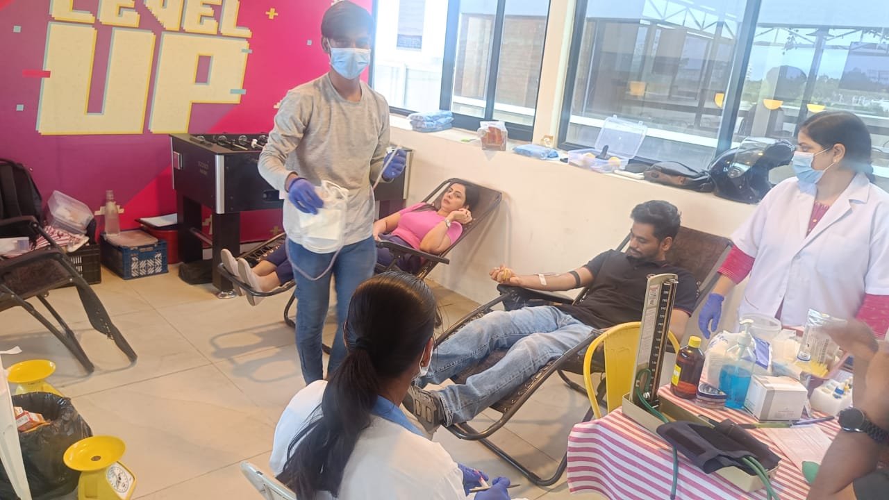 Medical professionals caring for donors during a blood donation camp